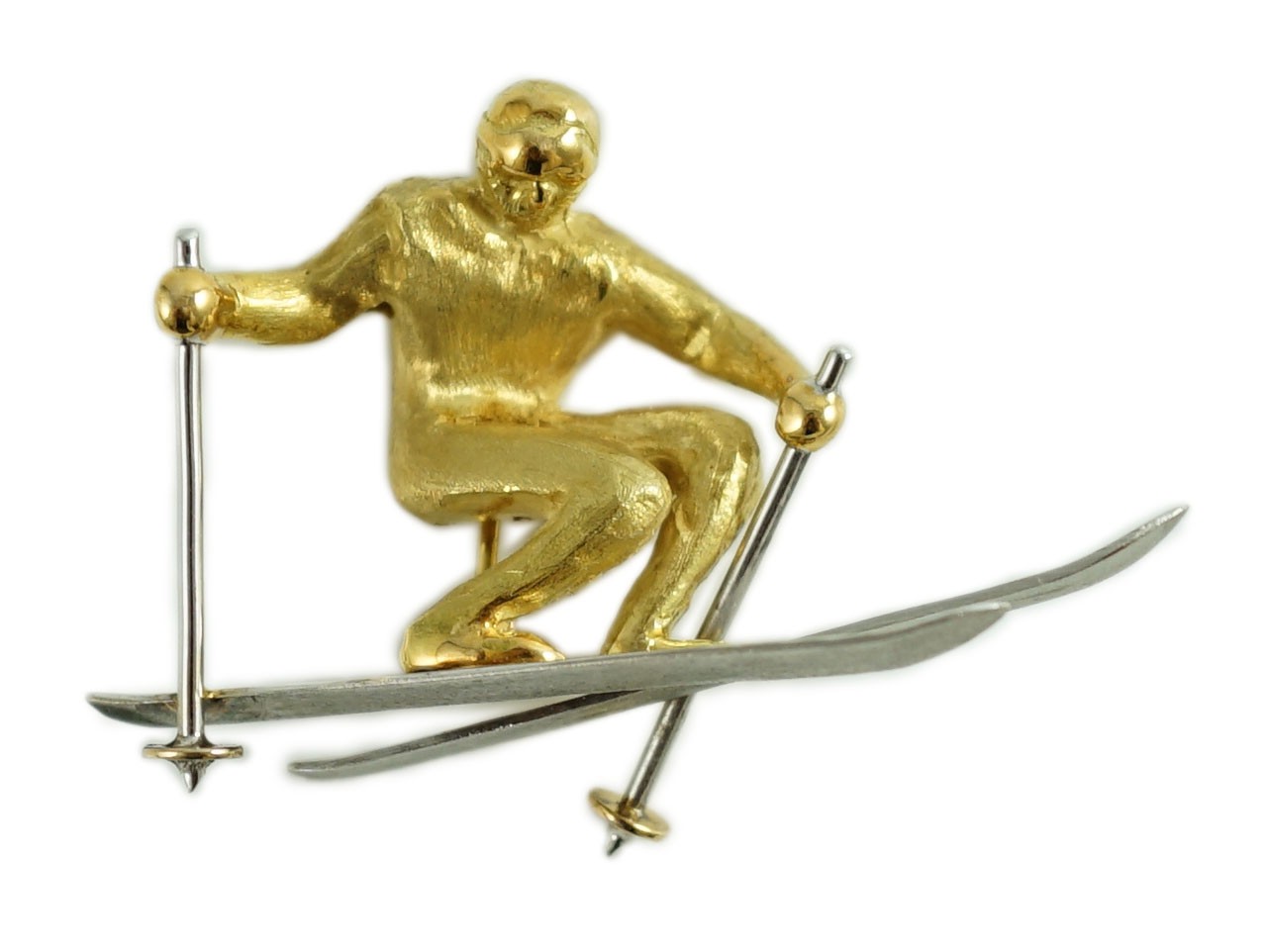 A gold and platinum novelty brooch modelled as a skier
